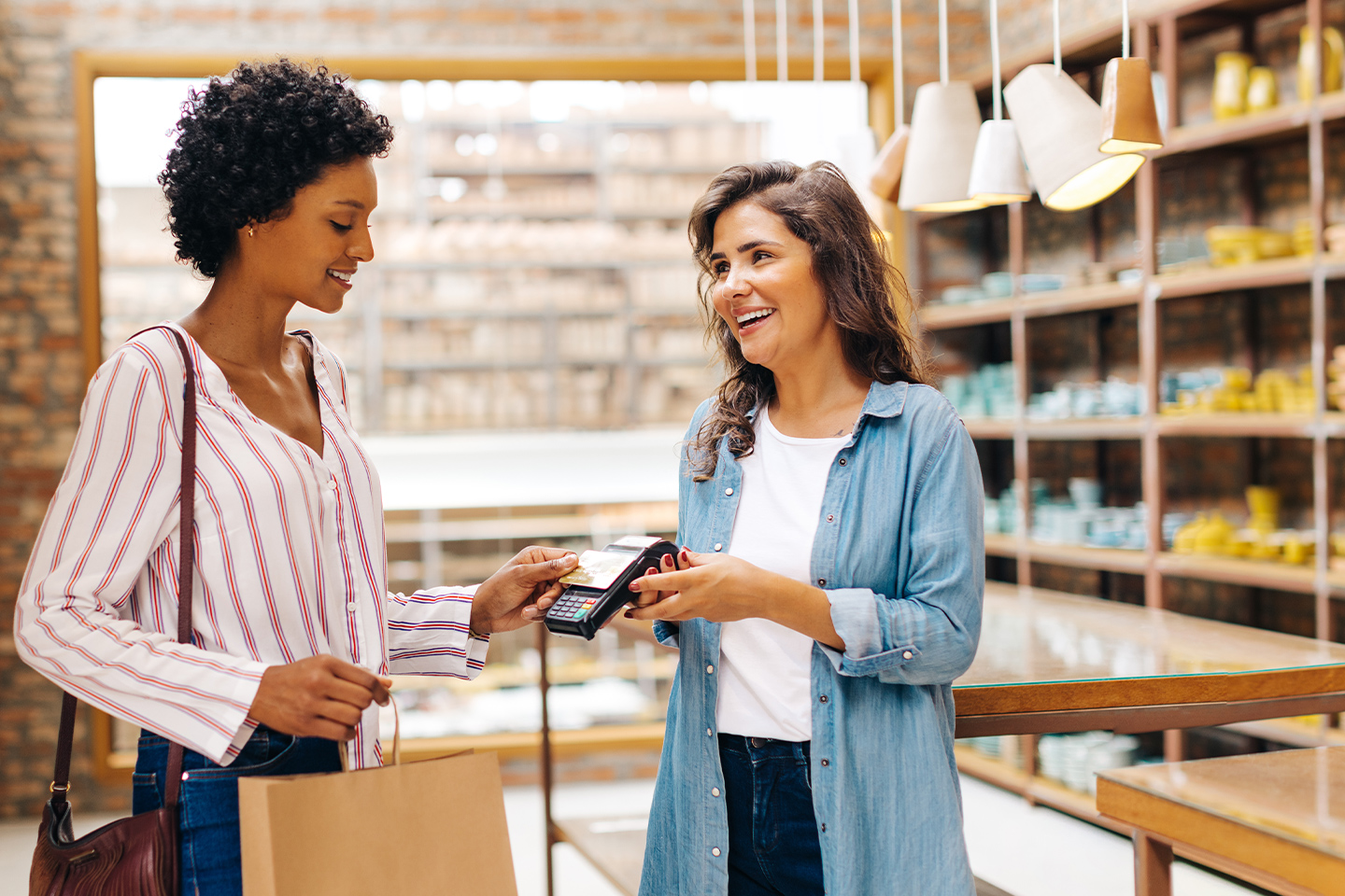 Woman shopping and paying with a credit card